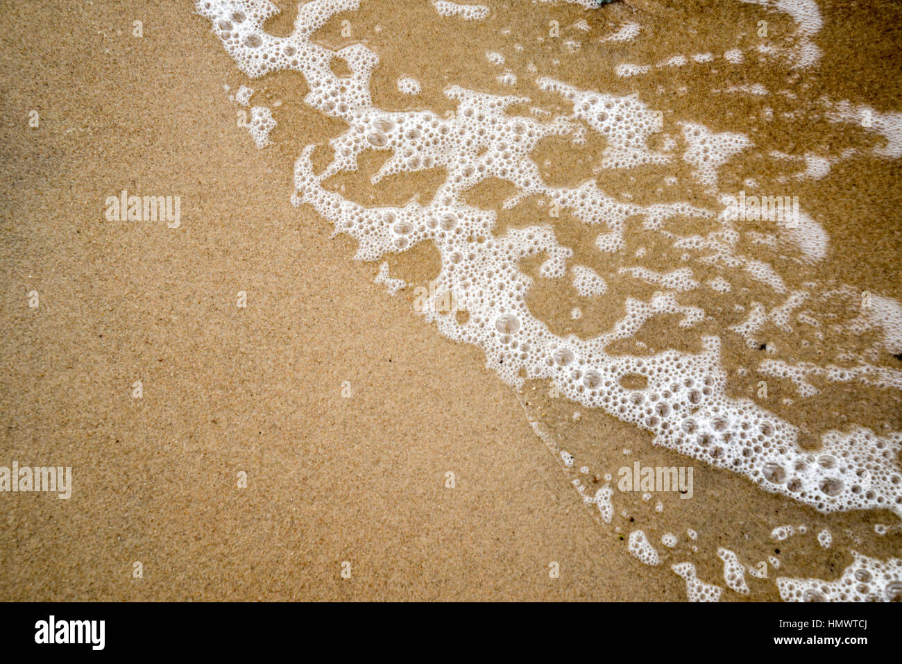 Sand Rushing water waves rushing in sand Stock Photo - Alamy