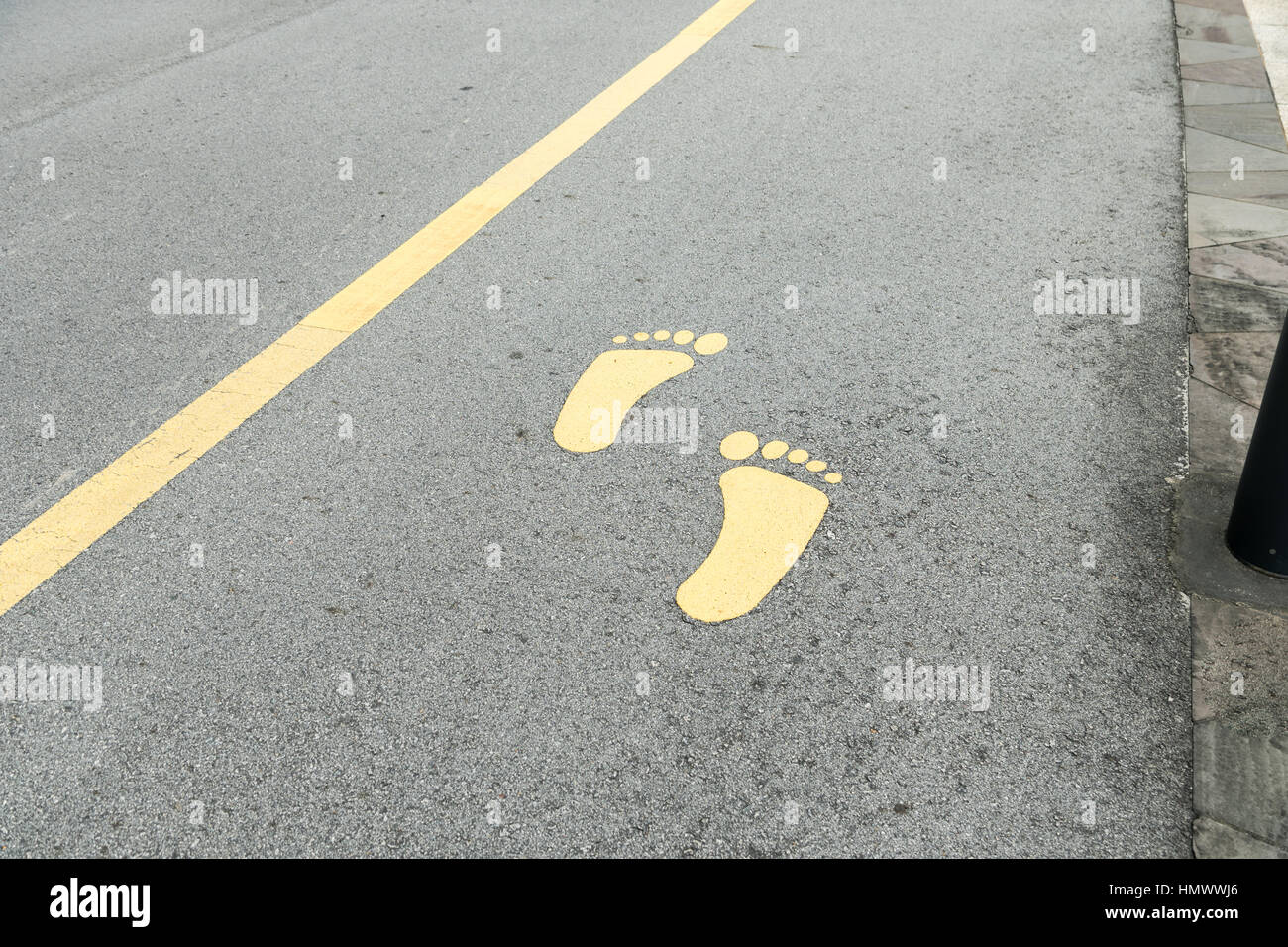 symbol of foot walk lane on road Stock Photo