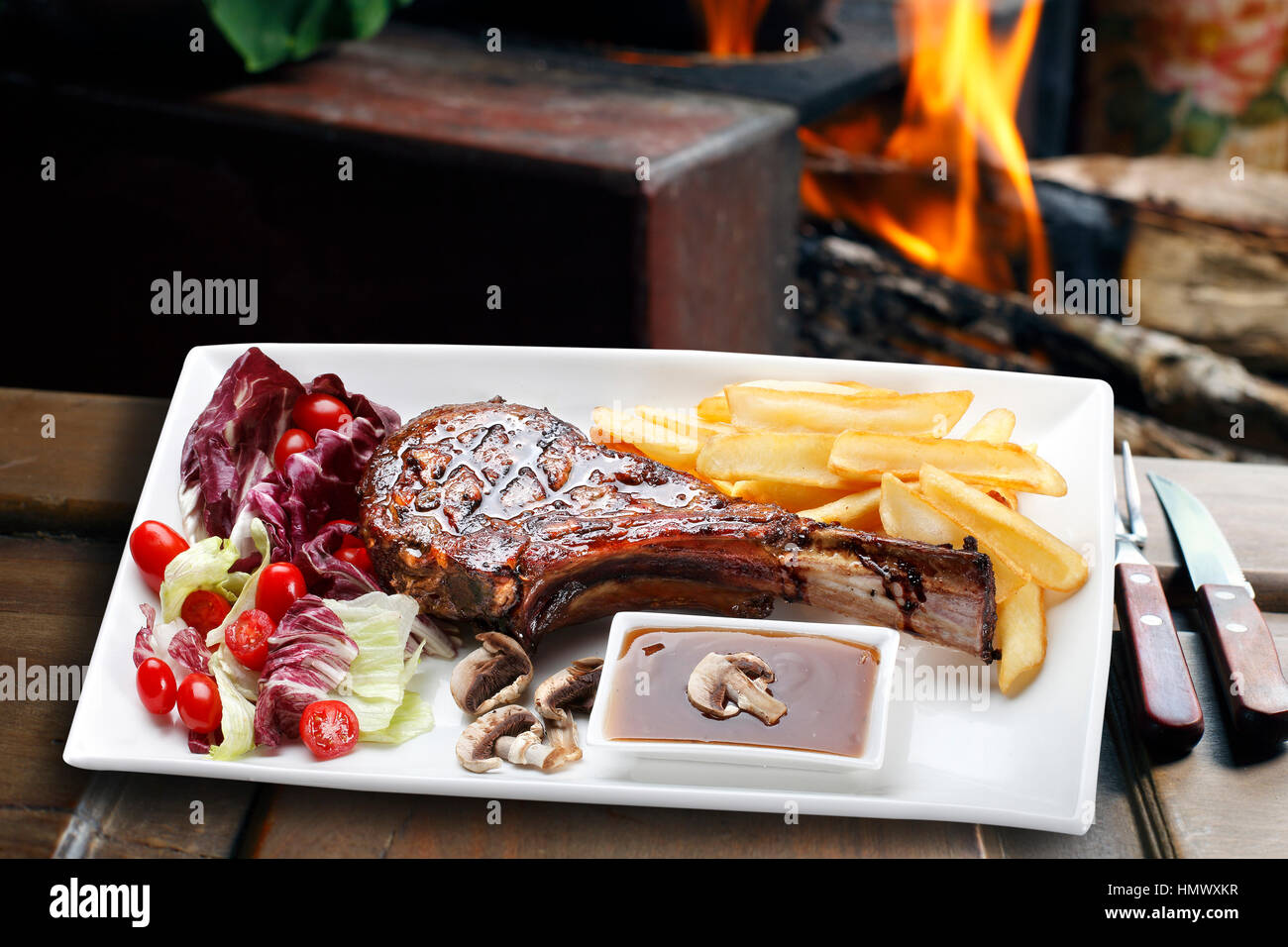 Prime rib with fries and salad Stock Photo - Alamy