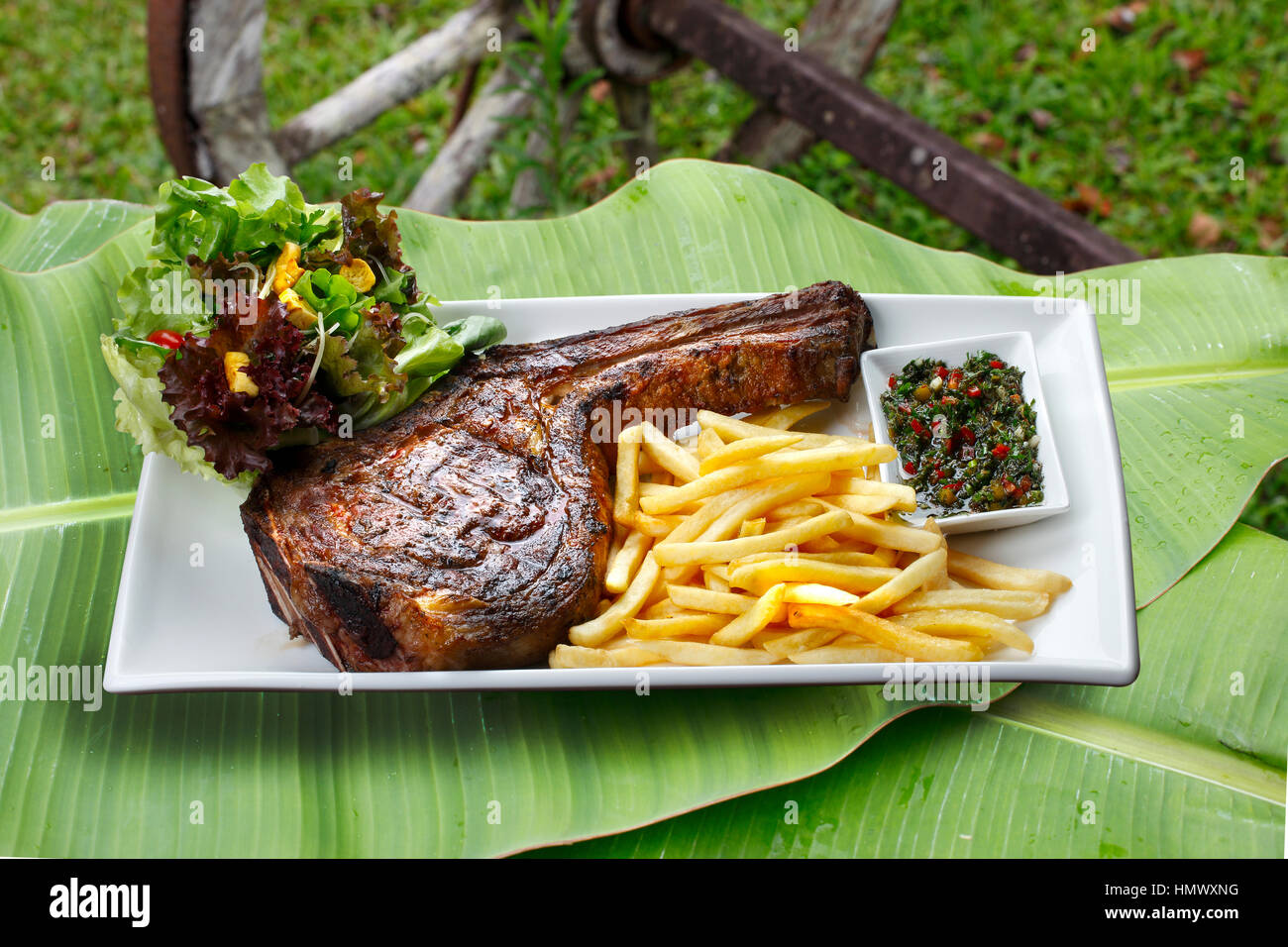 Prime rib with fries and salad Stock Photo - Alamy