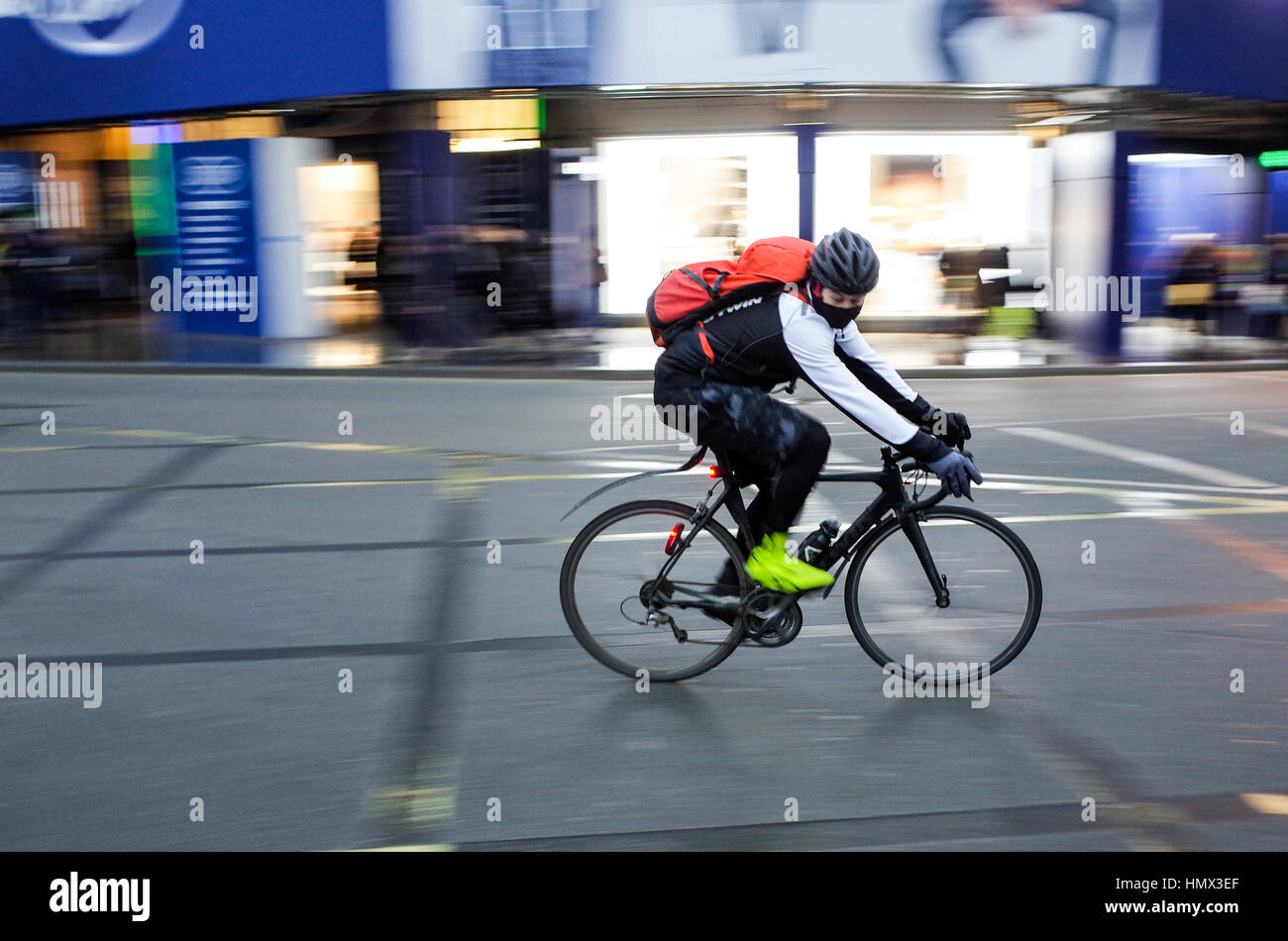 A commuter rides through Central London Stock Photo