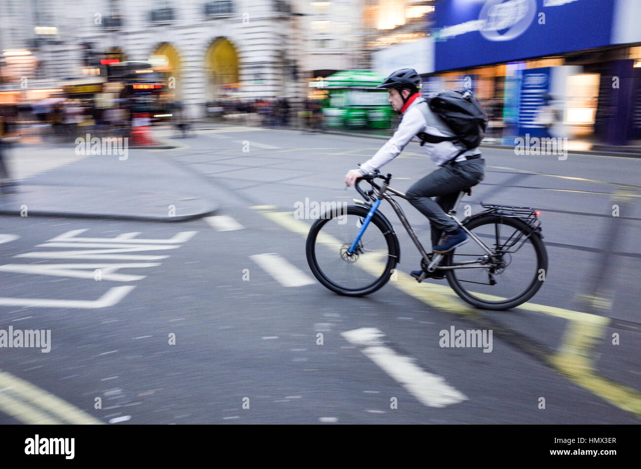 A commuter rides through Central London Stock Photo