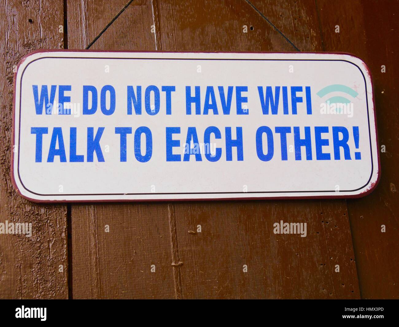Humorous no wifi sign in a Sri Lankan coffee shop encouraging customers to chat to each other instead of just checking their mobile phones Stock Photo