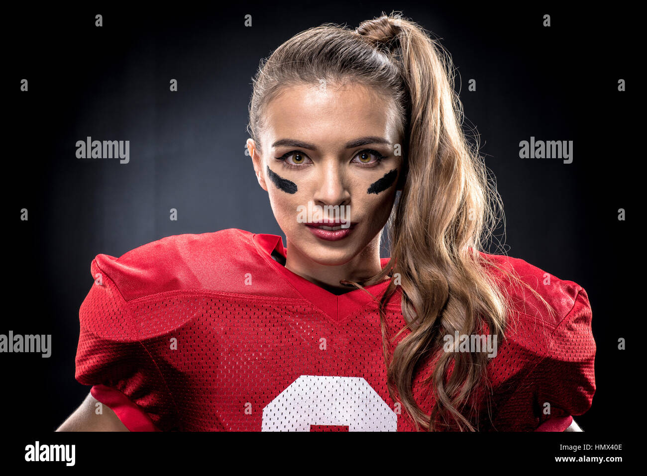Female american football player in uniform Stock Photo Alamy