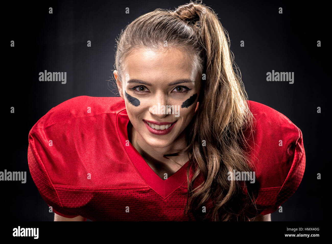 Female american football player in uniform Stock Photo Alamy