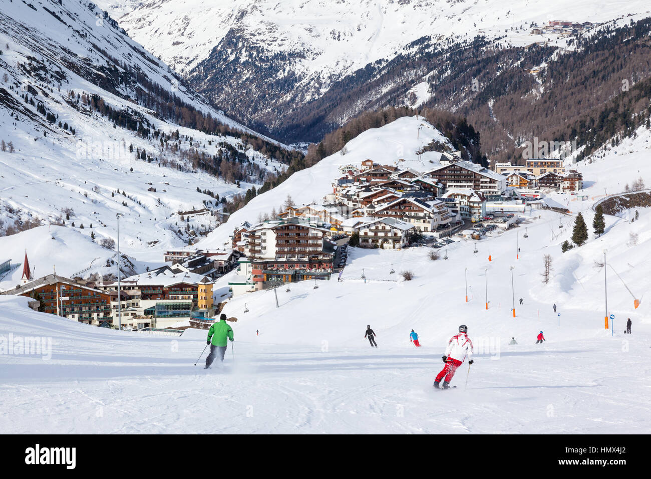 OBERGURGL, AUSTRIA - MARCH, 16 : People skiing down a piste at Obergurgl, Austria on 16th March 2013. Situated in the Otztal Alps at an elevation of 1 Stock Photo