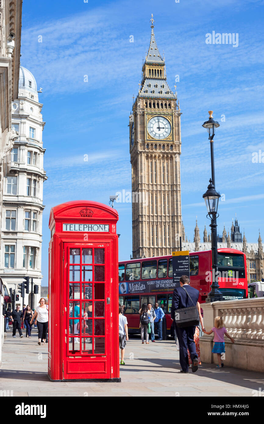 London, United Kingdom- September 4, 2012: General view of Great George Street in Westminster with people walking past a public telephone box, a red L Stock Photo