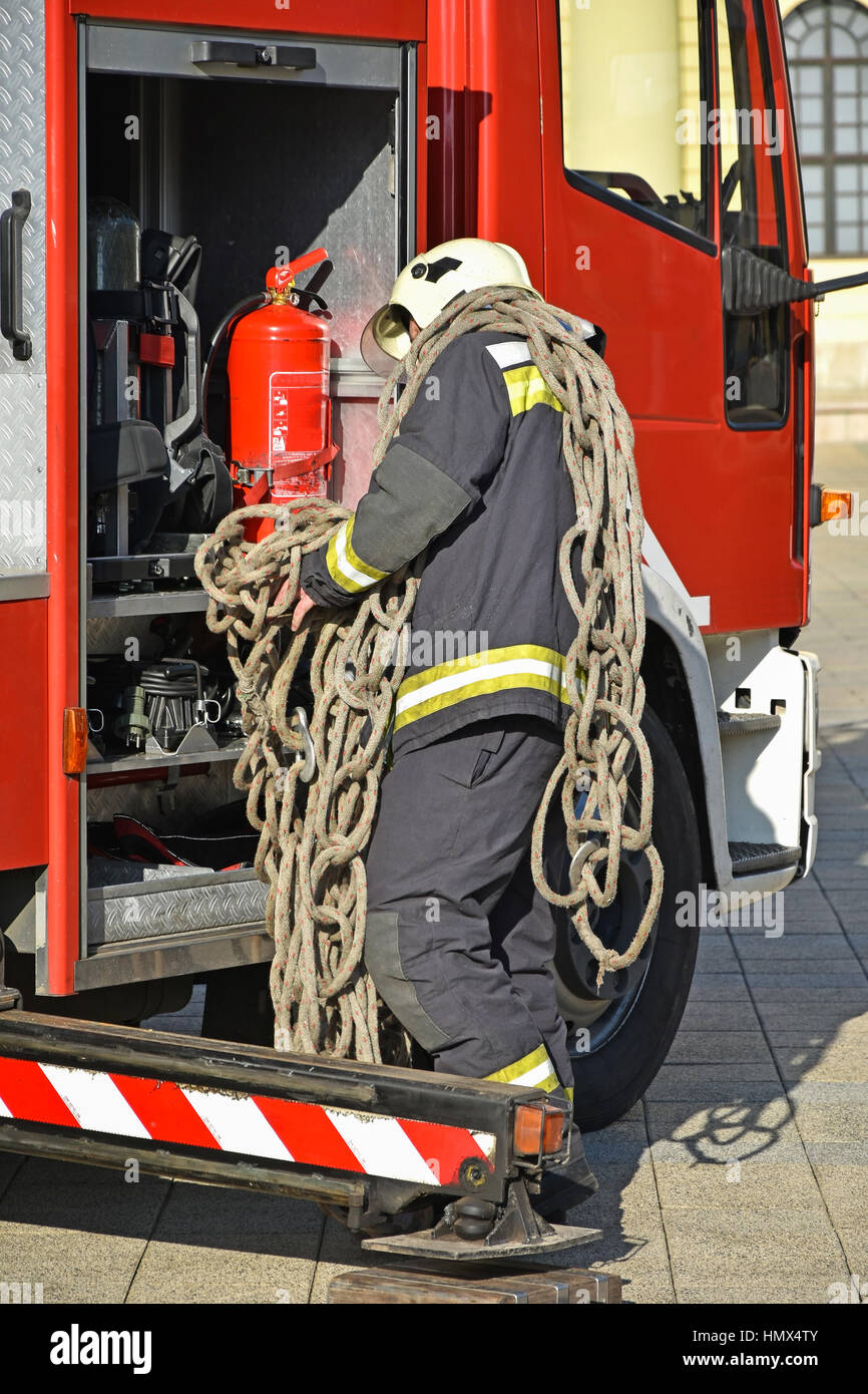 Firefighter at work with a rope Stock Photo