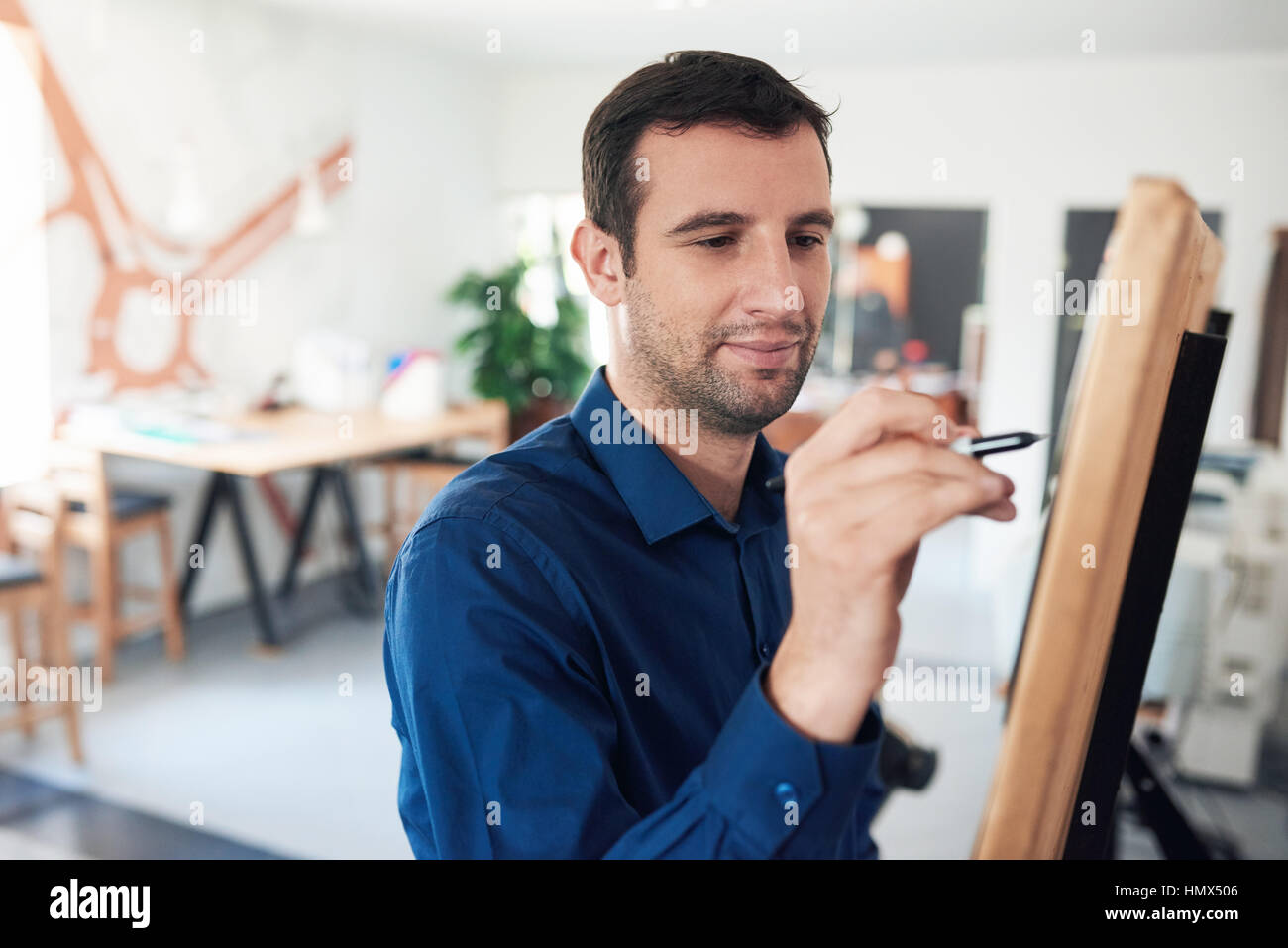 Businessman writing ideas on a whiteboard in an office Stock Photo