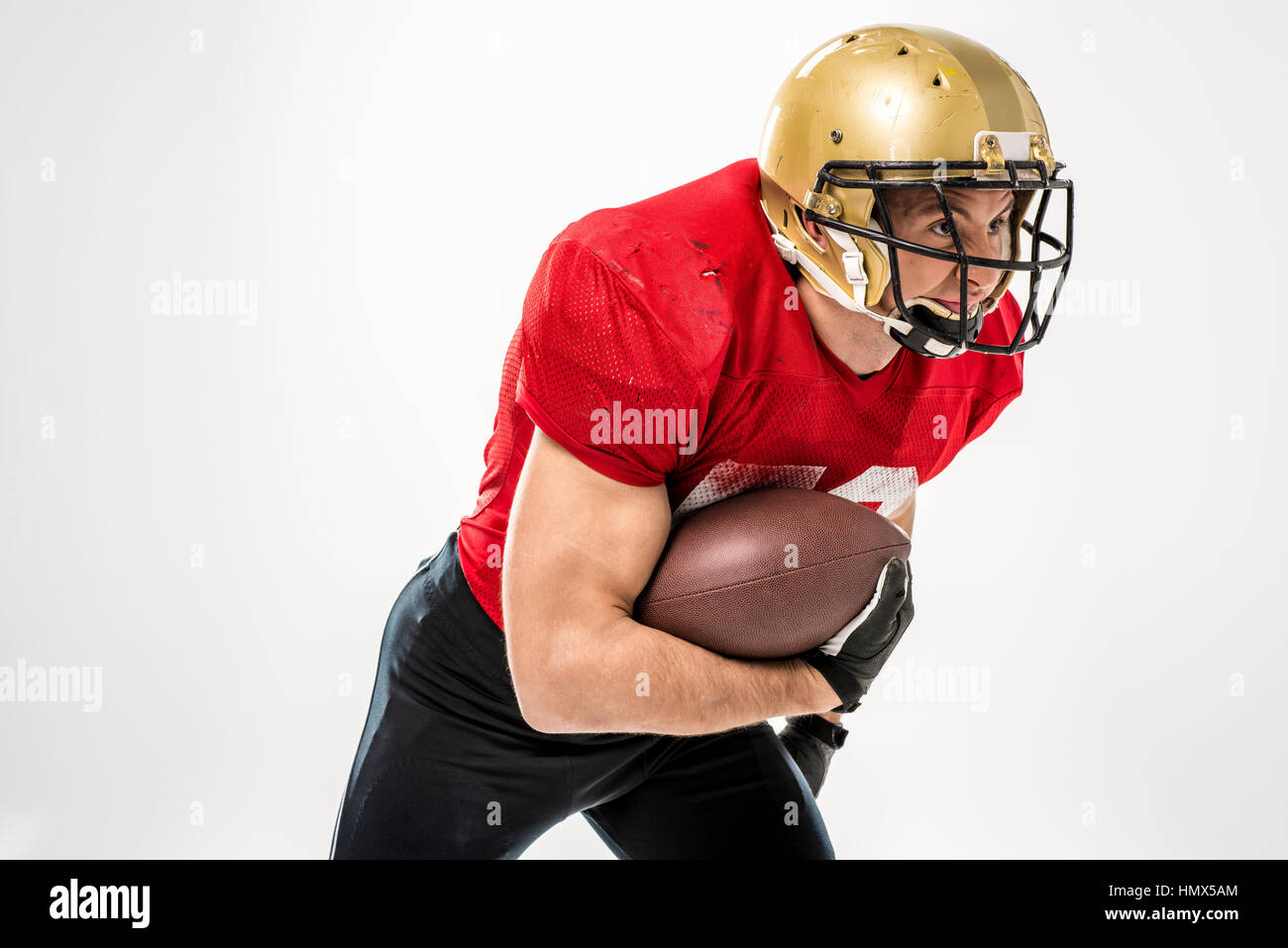 Football player running with ball Stock Photo