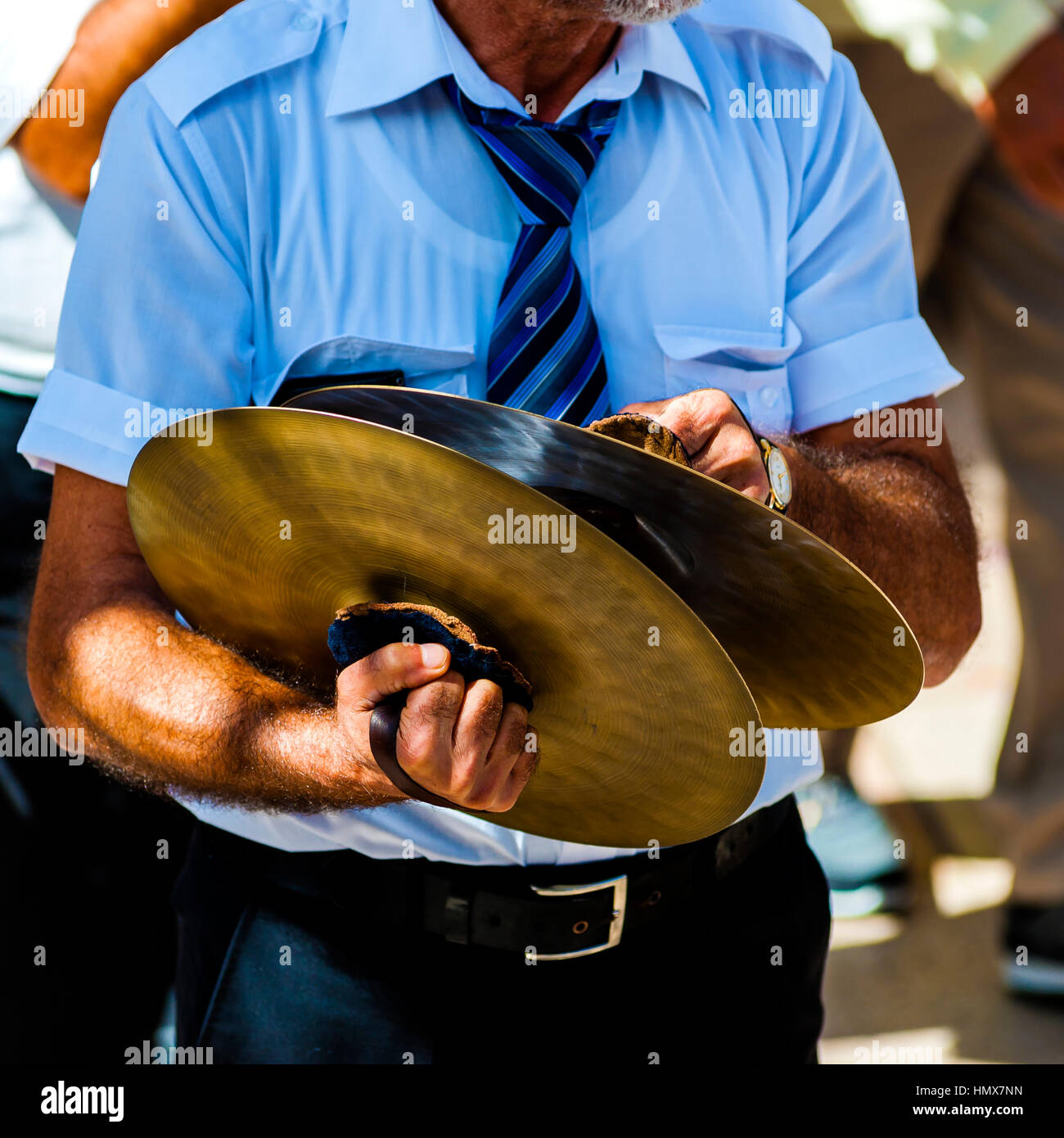 musician plays the cymbals during a religious procession Stock Photo