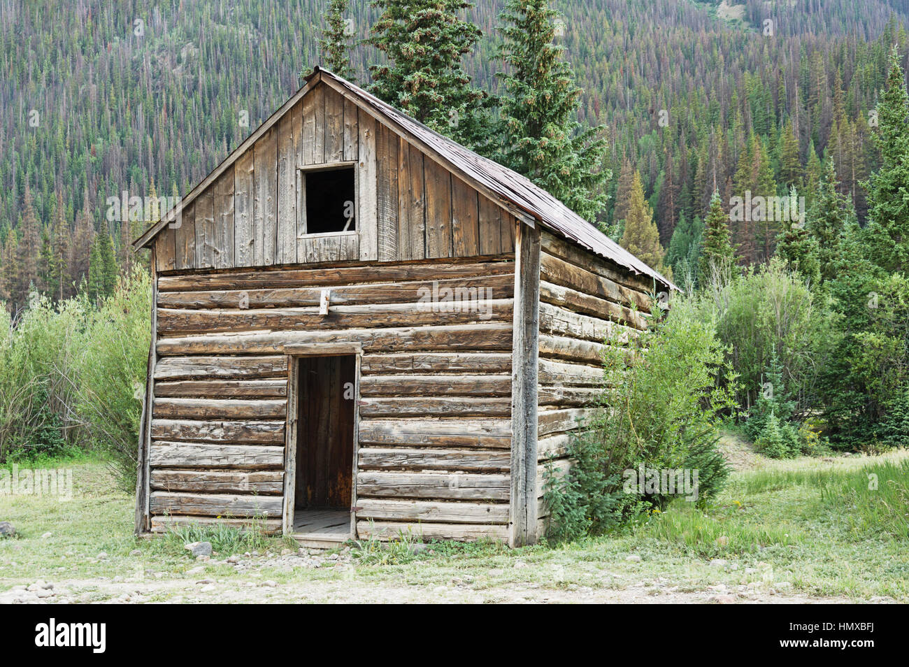 old log cabin in the mountains of Colorado Stock Photo