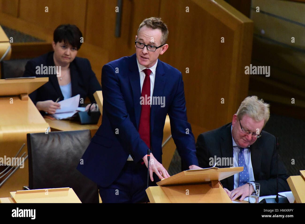 Edinburgh, UK. 7th Feb, 2017. Scottish Conservative spokesman John Lamont speaking in the Scottish Parliament during the debate on the triggering of Article 50 in the Brexit process, with leader Ruth Davidson and deputy leader Jackson Carlaw in the background, Credit: Ken Jack/Alamy Live News Stock Photo