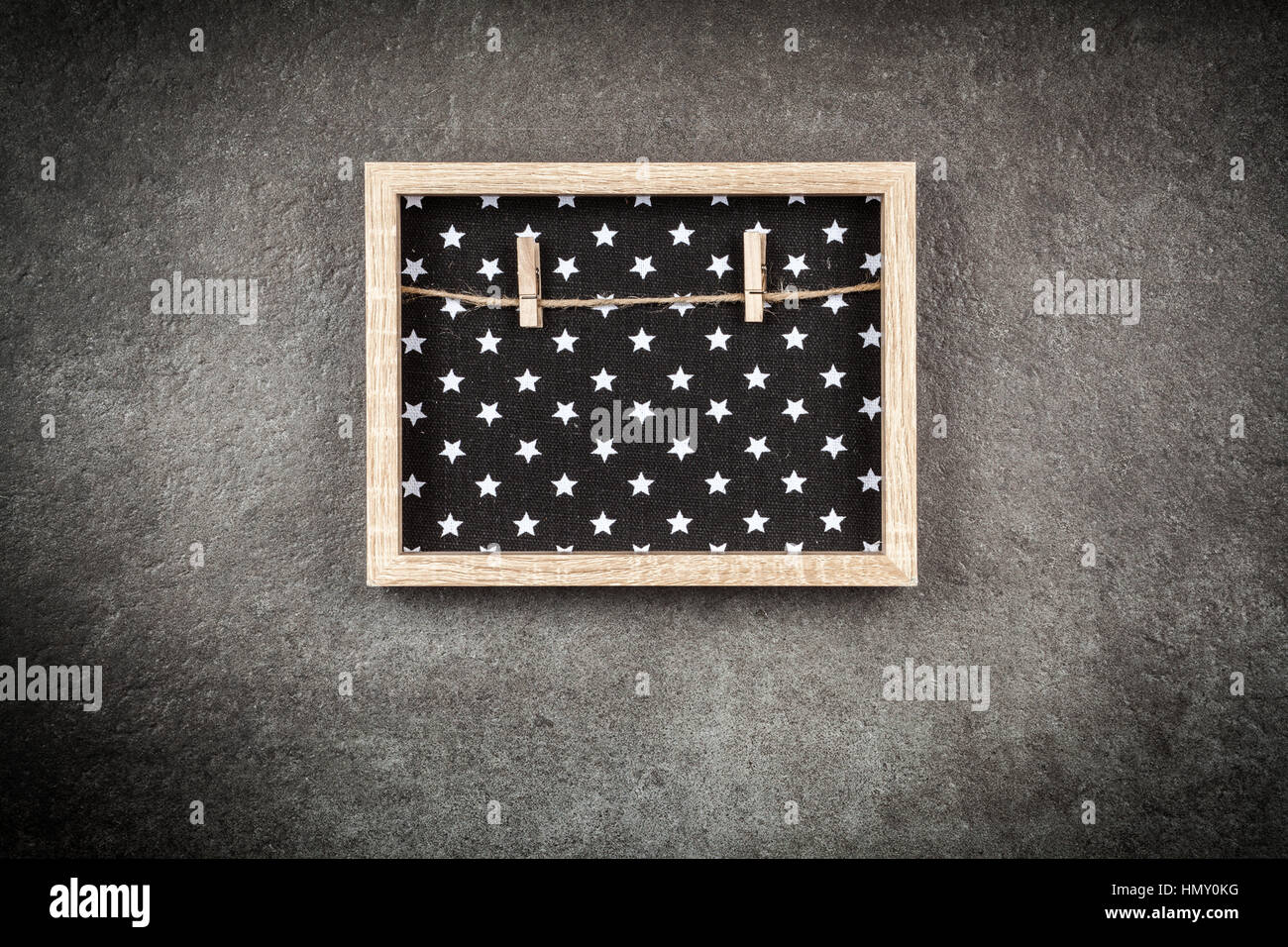 Picture frame on a grey wall Stock Photo - Alamy