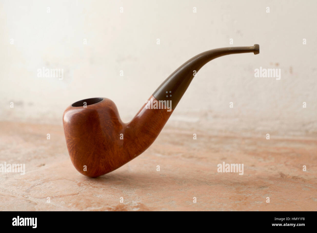 A wooden smoking pipe Stock Photo