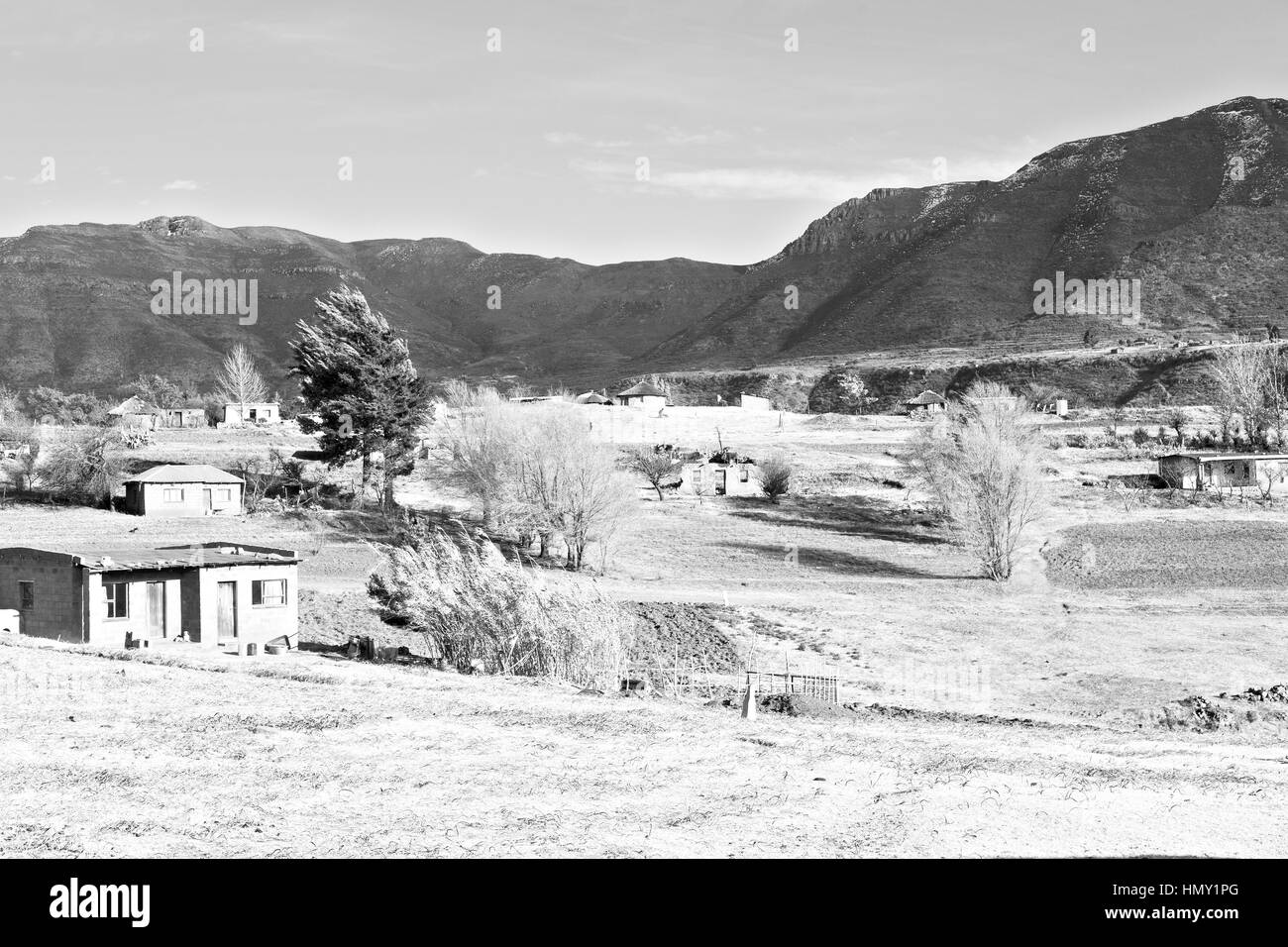 blur  in lesotho malealea street village near  mountain and coultivation field Stock Photo