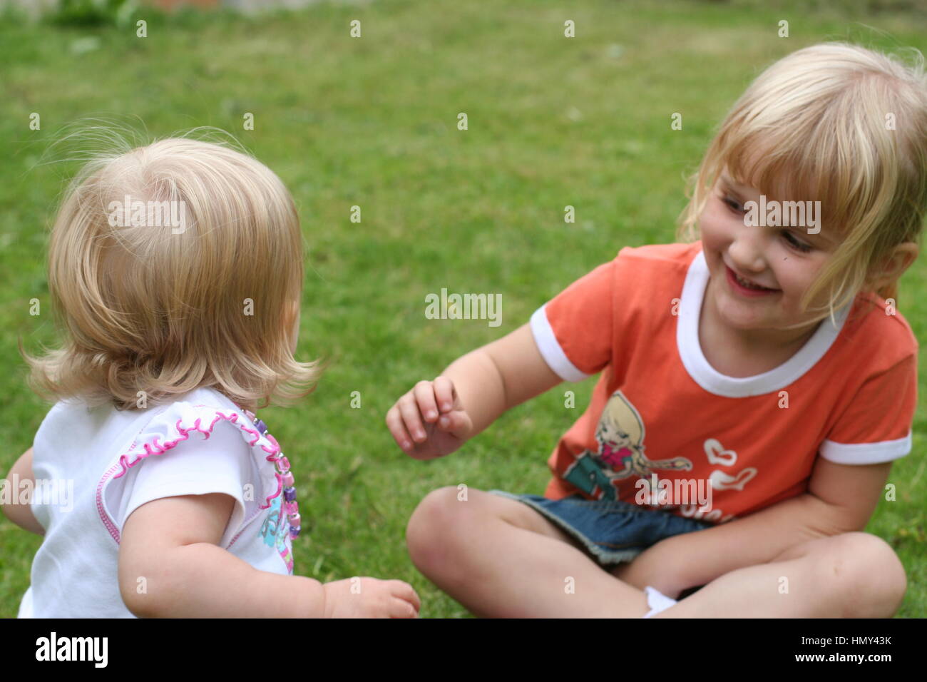 Two little girls laughing hi-res stock photography and images - Alamy