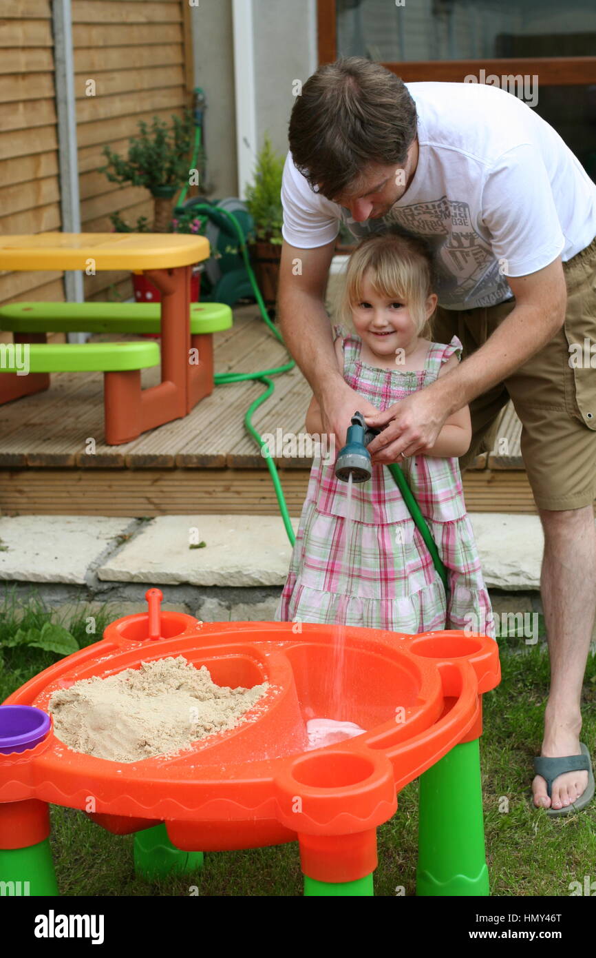 Children playing in sand pit hi-res stock photography and images - Alamy