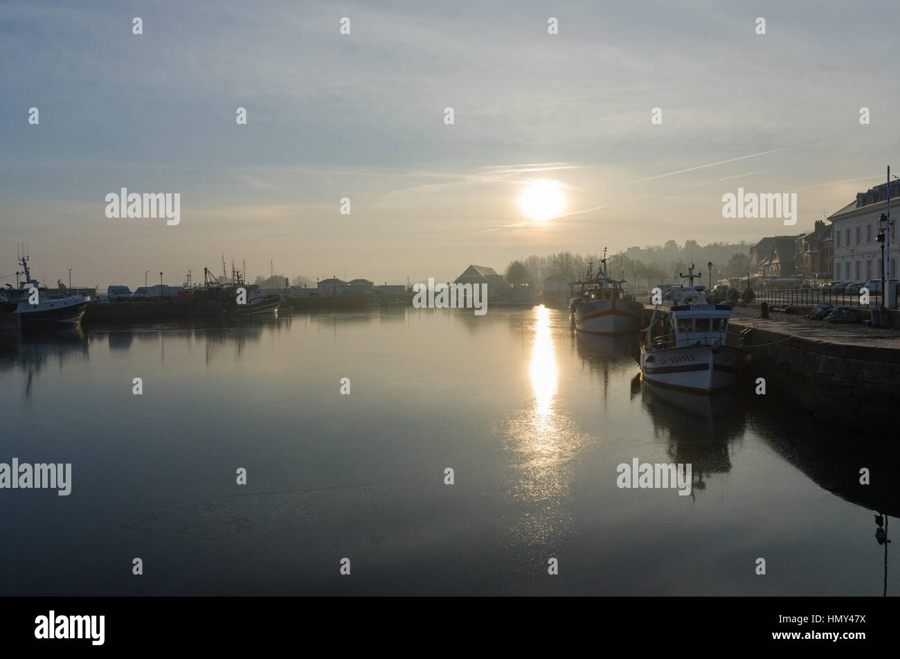 Sunrise over Honfleur in Normandy on a misty winter morning Stock Photo