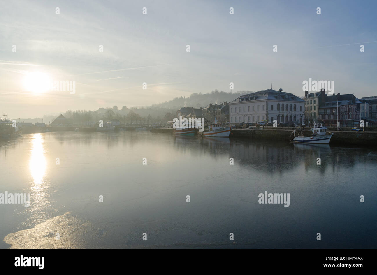 Sunrise on a misty winter morning in Honfleur, Normandy Stock Photo