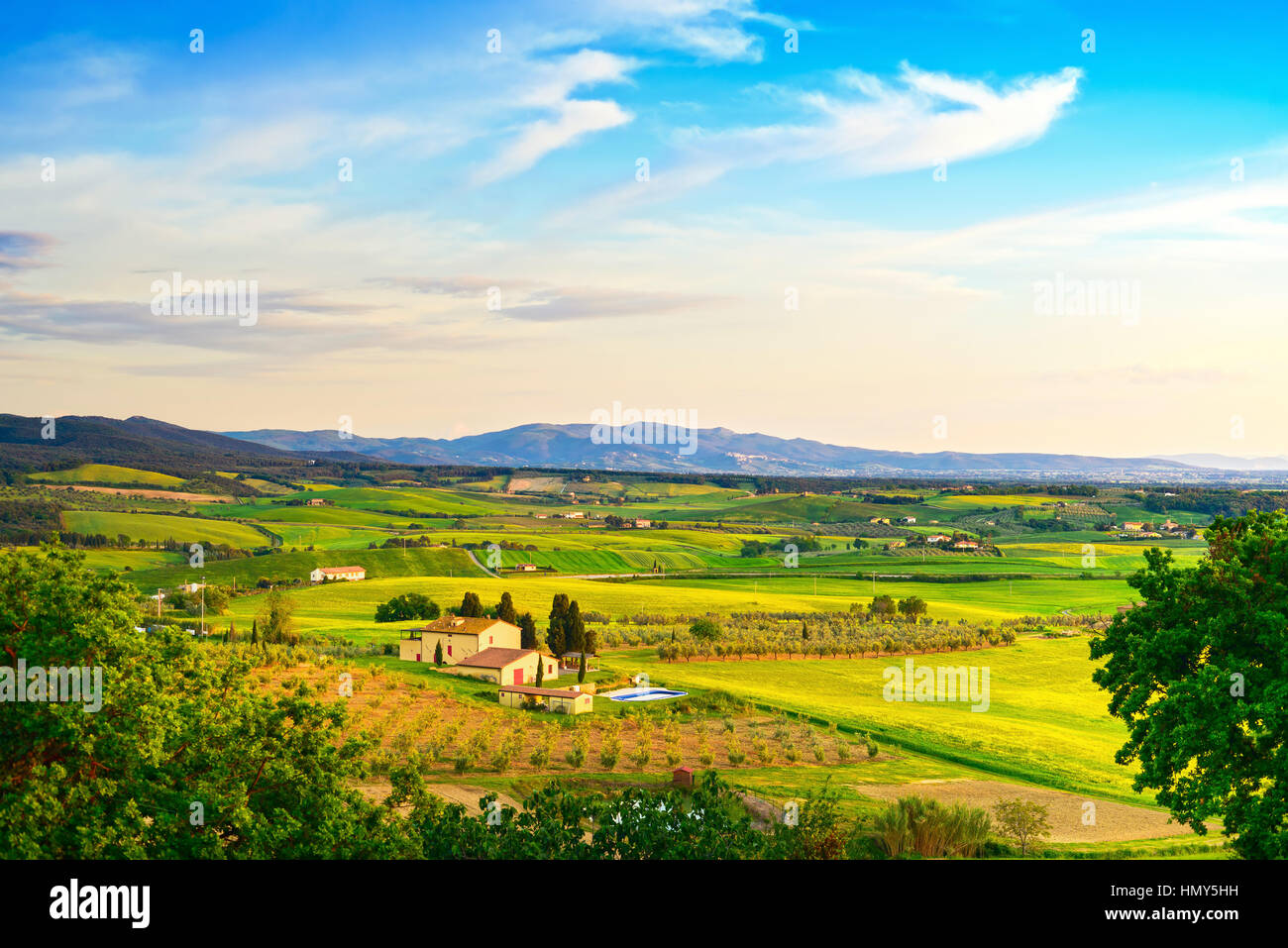 Maremma, rural sunset landscape. Countryside farmland and green fields. Tuscany, Italy, Europe. Stock Photo