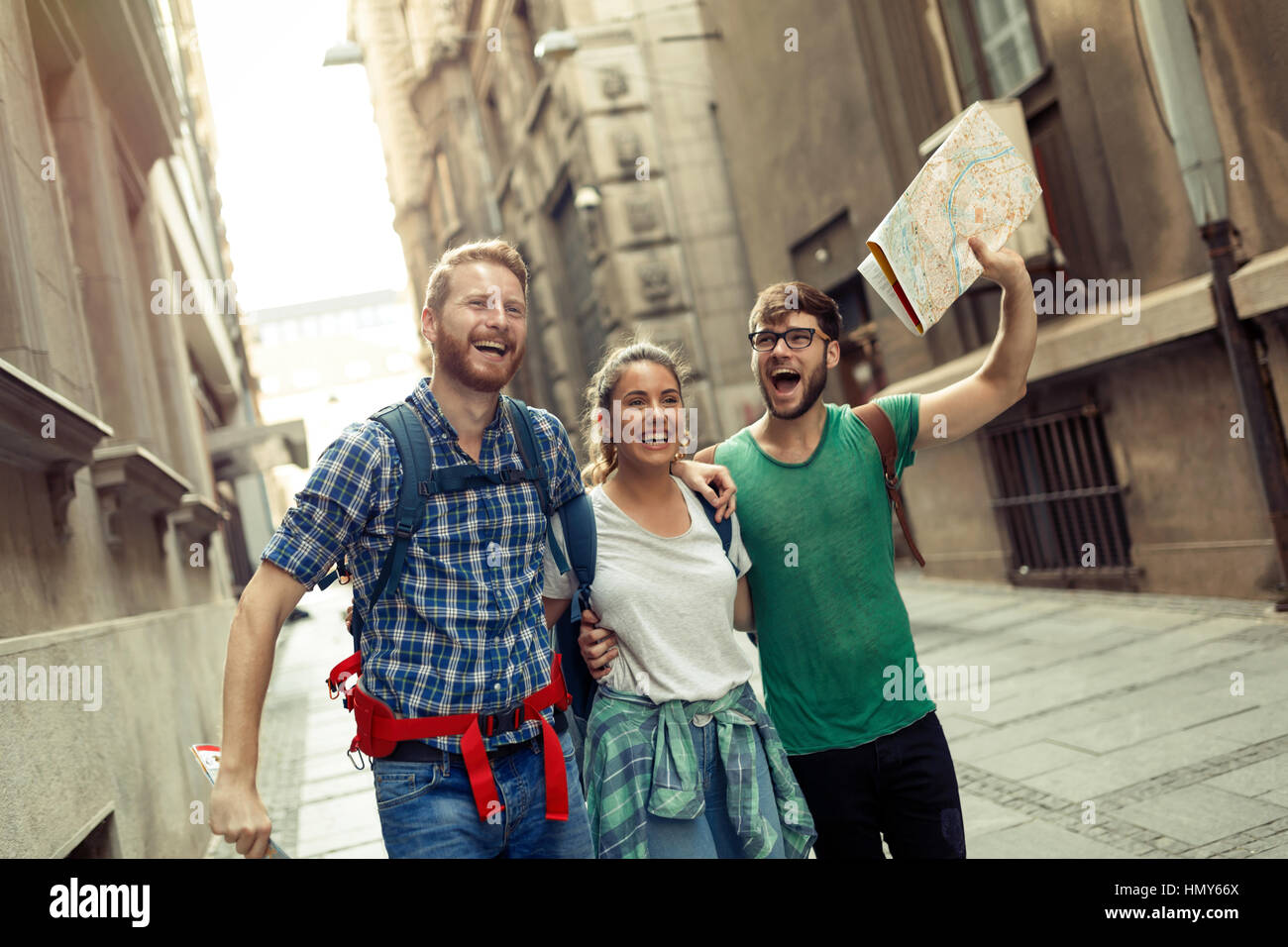 Happy group of students on sightseeing and travel adventure Stock Photo