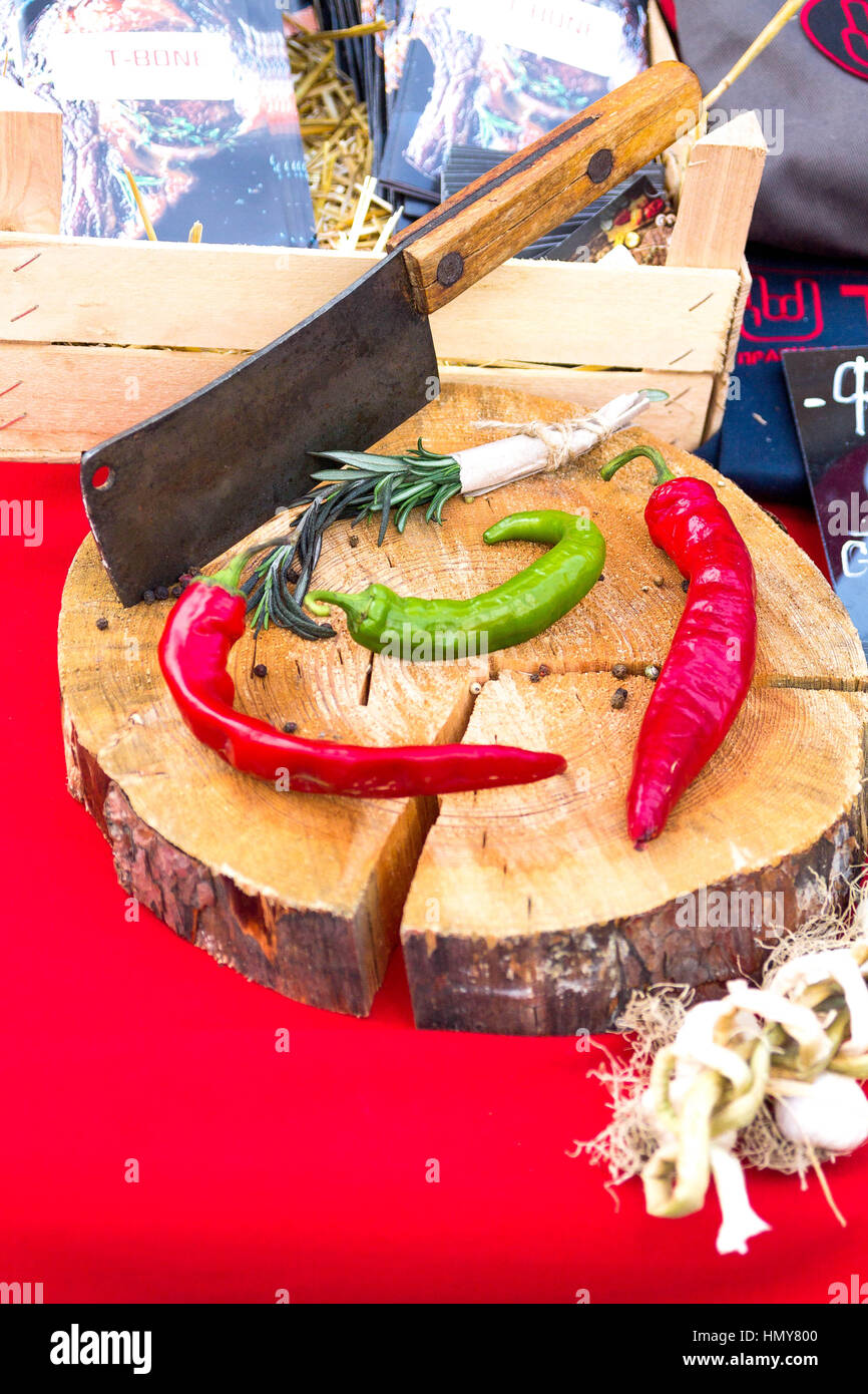 Hot red and green peppers on a wooden background. Arrangement of chili pepper. Stock Photo