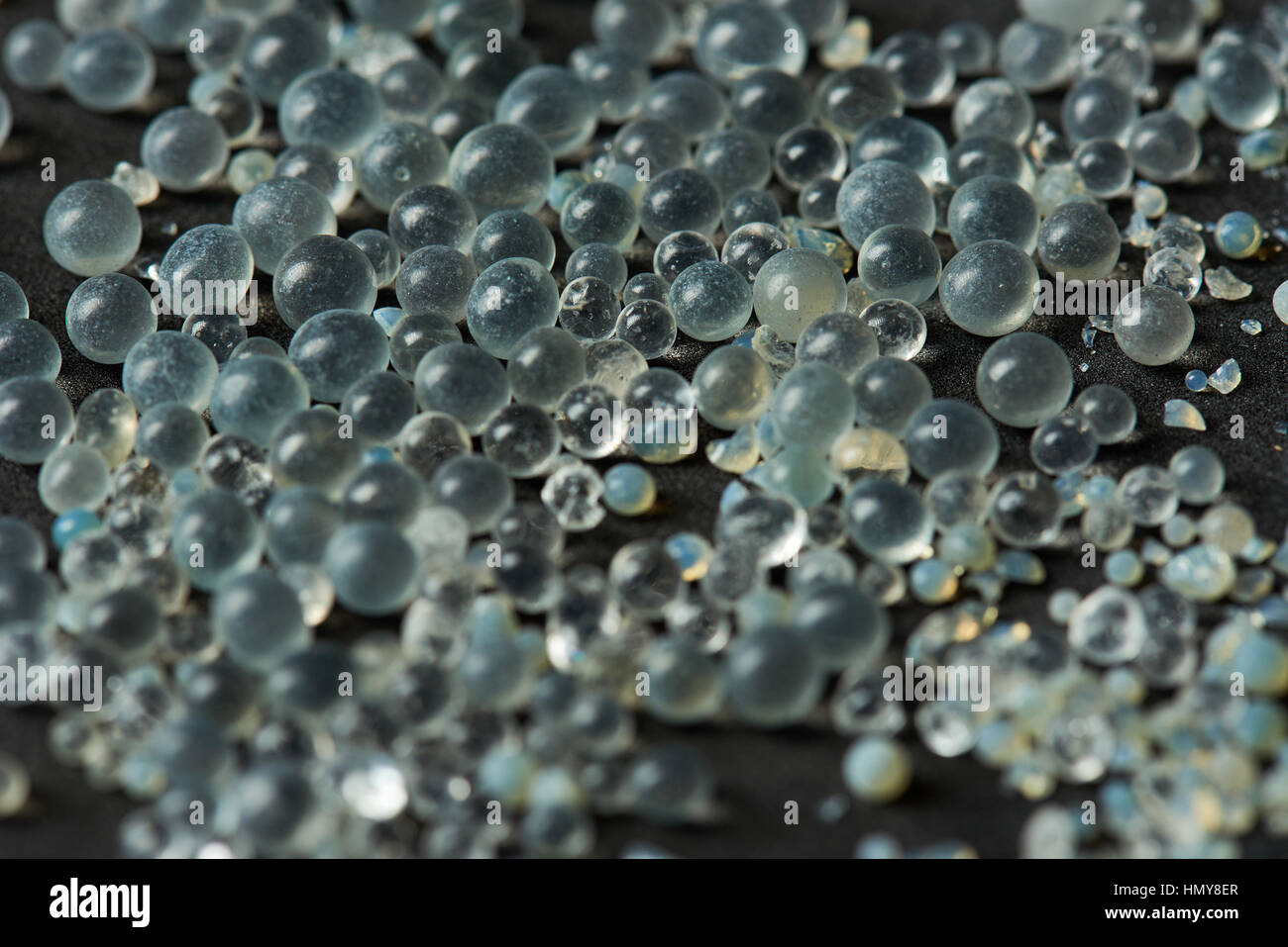 macro of silica gel balls laying on black background Stock Photo