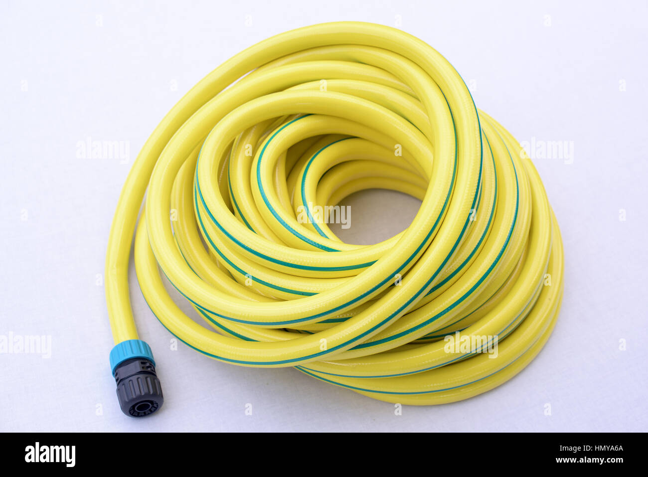 Garden hose-pipe whit coupling on a white background Stock Photo