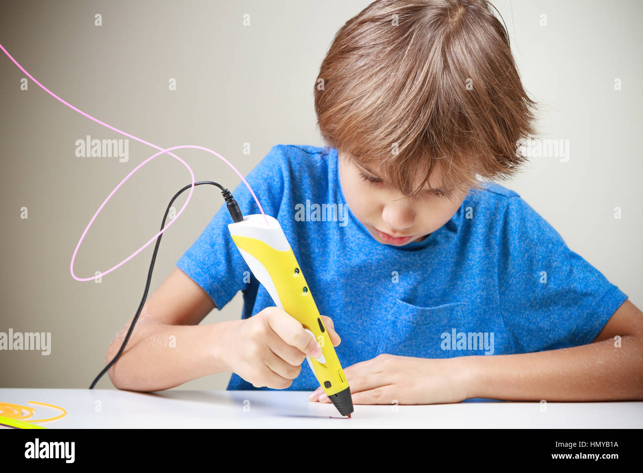 Child using 3D printing pen. Boy making new item. Creative, leisure ...