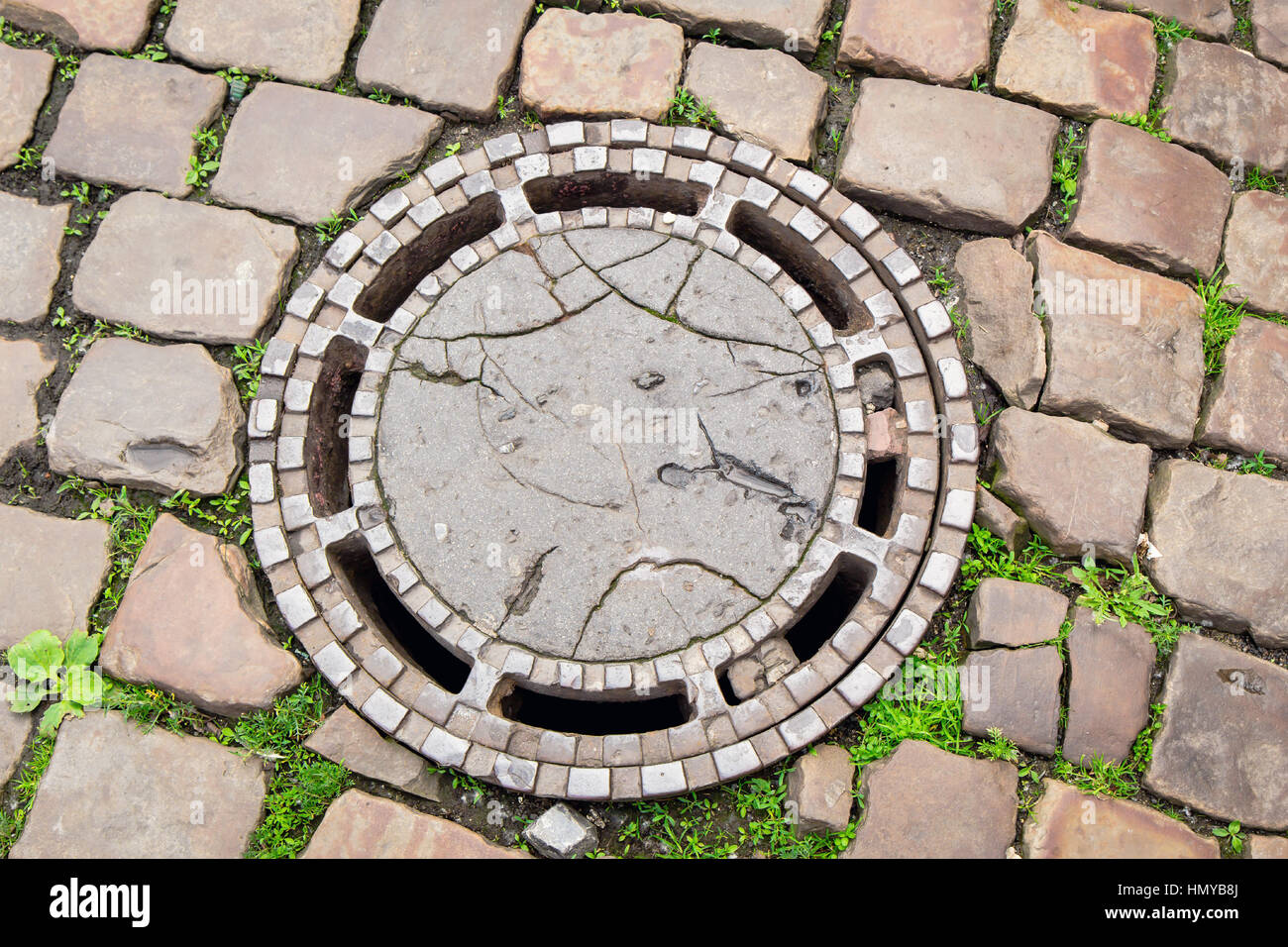 Old sewerage hatchway Stock Photo