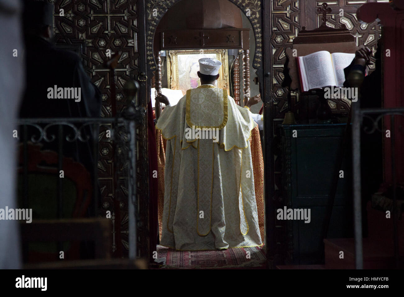 Jerusalem, Israel - November 24, 2013: An Ethiopian monk holds mass in Ethiopian Chapel in the Church of Holy Sepulchre in Jerusalem. Stock Photo