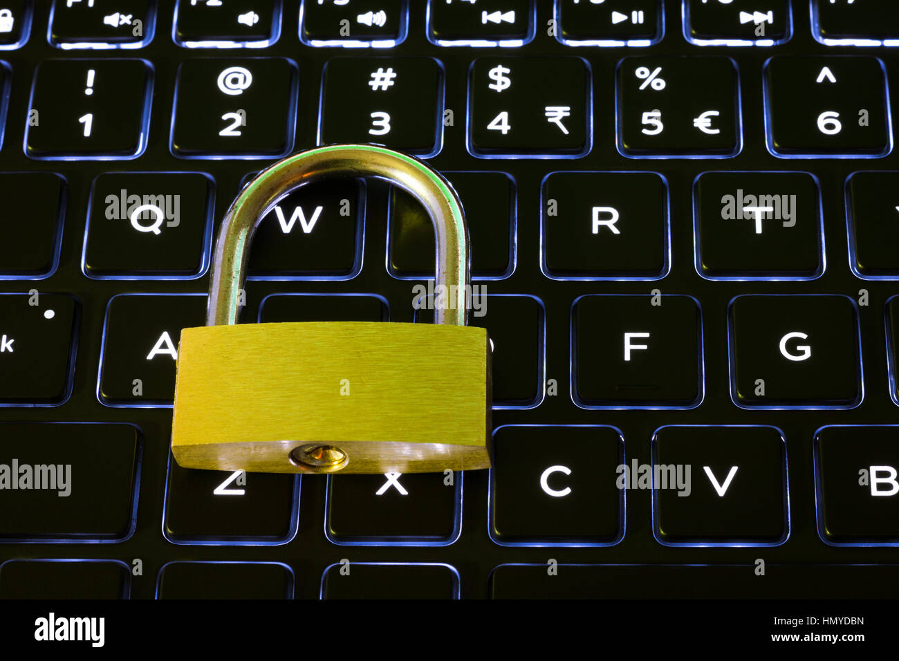 Closed security lock on a backlit computer keyboard Stock Photo