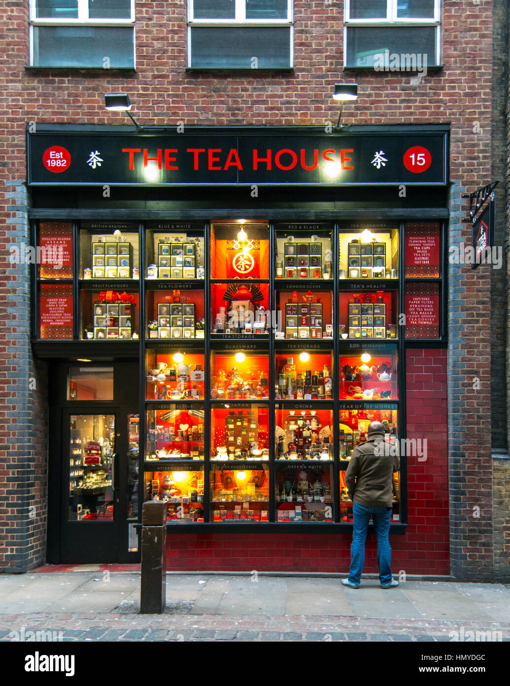 Old tea shop in London England with a man looking in the widow Stock Photo