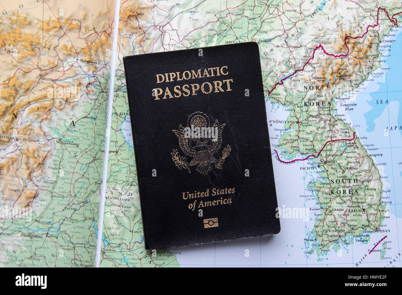 Diplomatic passport of the United States of America, on a map of North and South Korea Stock Photo