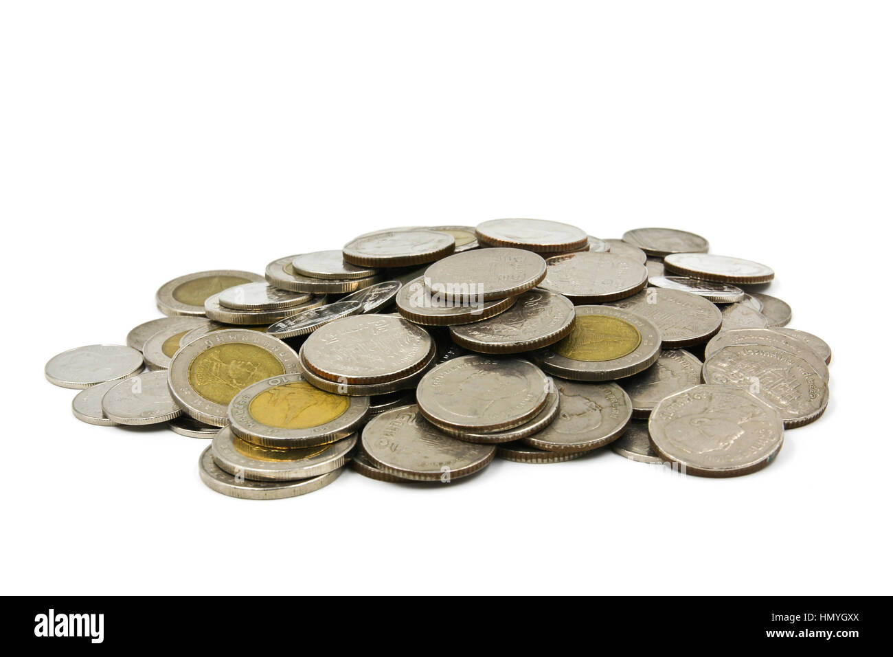 A pile of coins on white background Stock Photo - Alamy