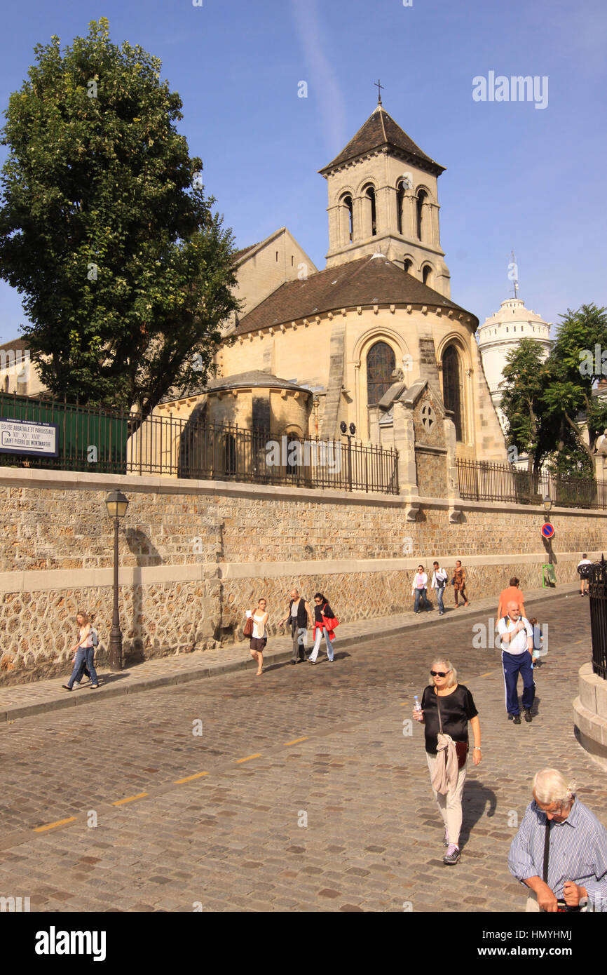 Tourist wandering around the area of Sacre-Coeur Basilica of the Sacred Heart Carmel de Montmartre, Paris, France Stock Photo