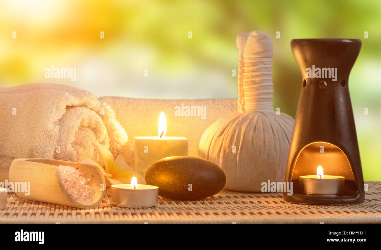 spa burning candles and zen stone Stock Photo