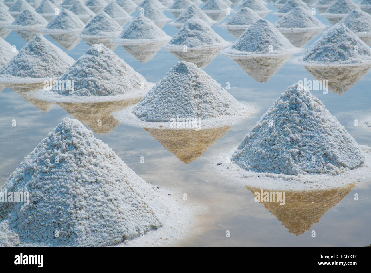Heap of sea salt in original salt produce farm make from natural ocean salty water preparing for last process before sent it to industry consumer Stock Photo