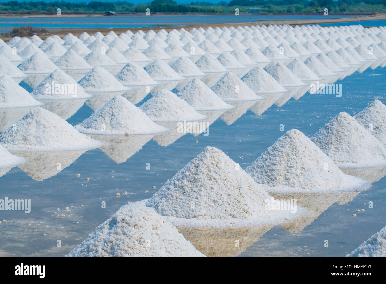Heap of sea salt in original salt produce farm make from natural ocean salty water preparing for last process before sent it to industry consumer Stock Photo