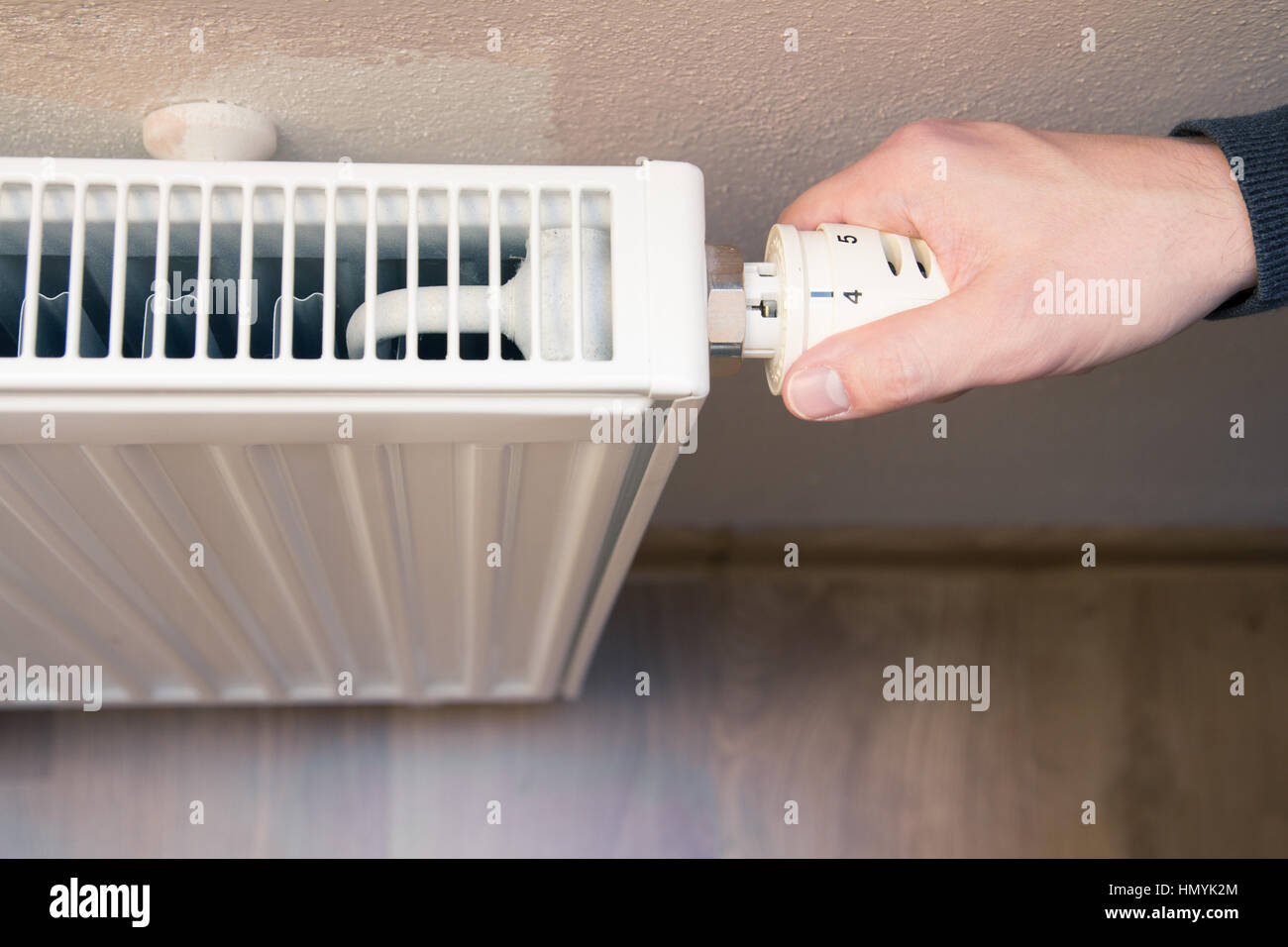 hand on heater Stock Photo