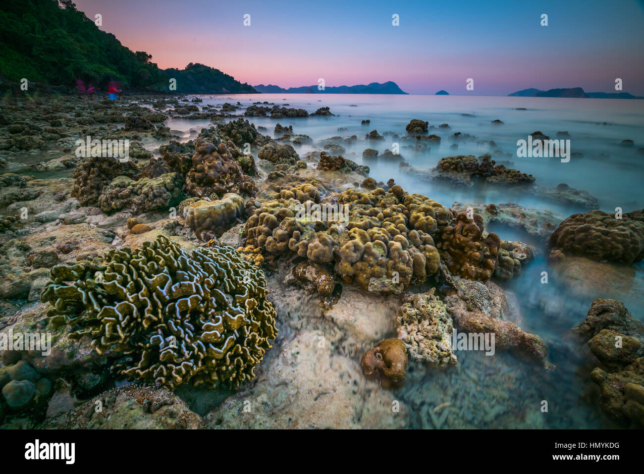 coral rock around beach during ebb tide and sunset time wide shot backgroundat  Nyaung Oo Phee, Myanmar Stock Photo