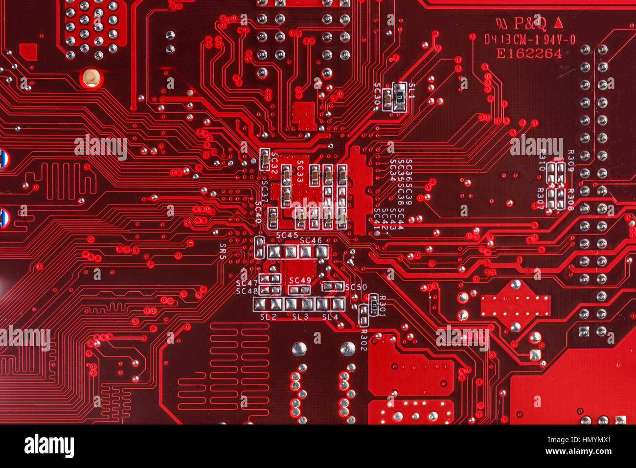 Red circuit board background of computer motherboard Stock Photo - Alamy