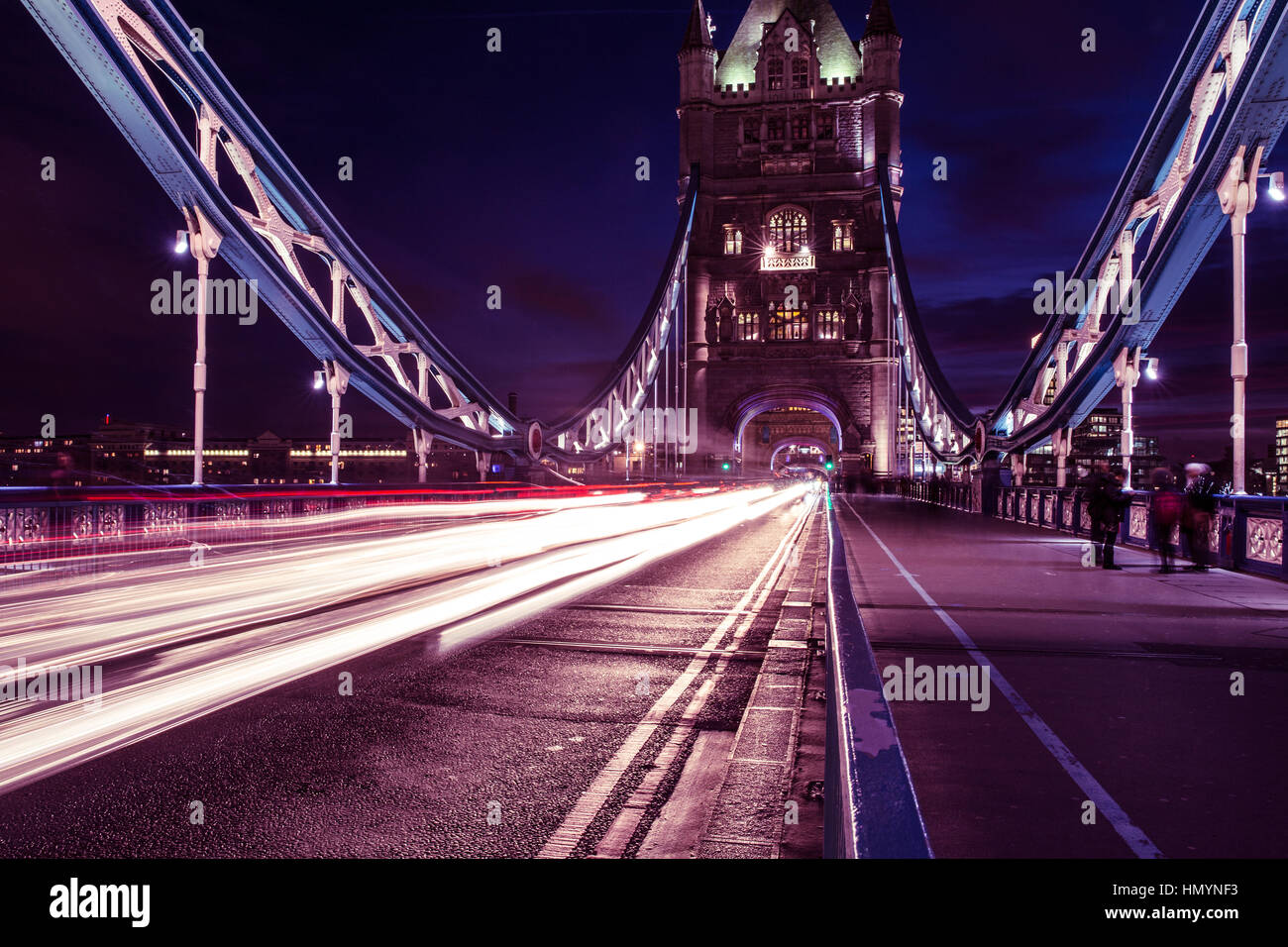 Car traffic light trails on Tower Bridge in London at night Stock Photo ...