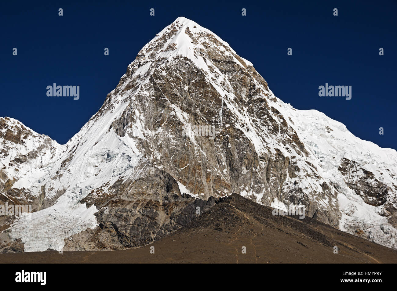 Pumori or Pumo Ri a 7161 meter mountain in the Everest region of the Himalaya with Kala Patthar below it Stock Photo