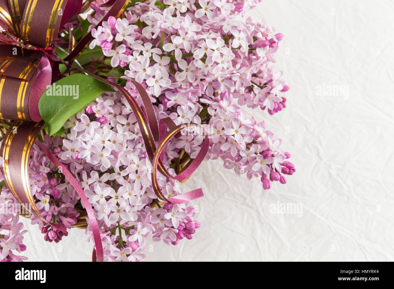 Purple lilac flowers bouquet on white fabric Stock Photo