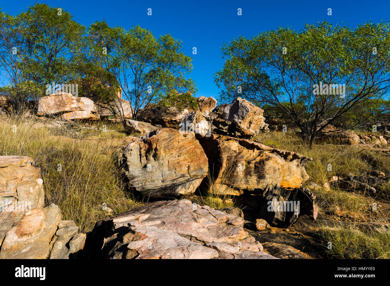 Boulders on the rocky foreshore of remote desert island. Stock Photo