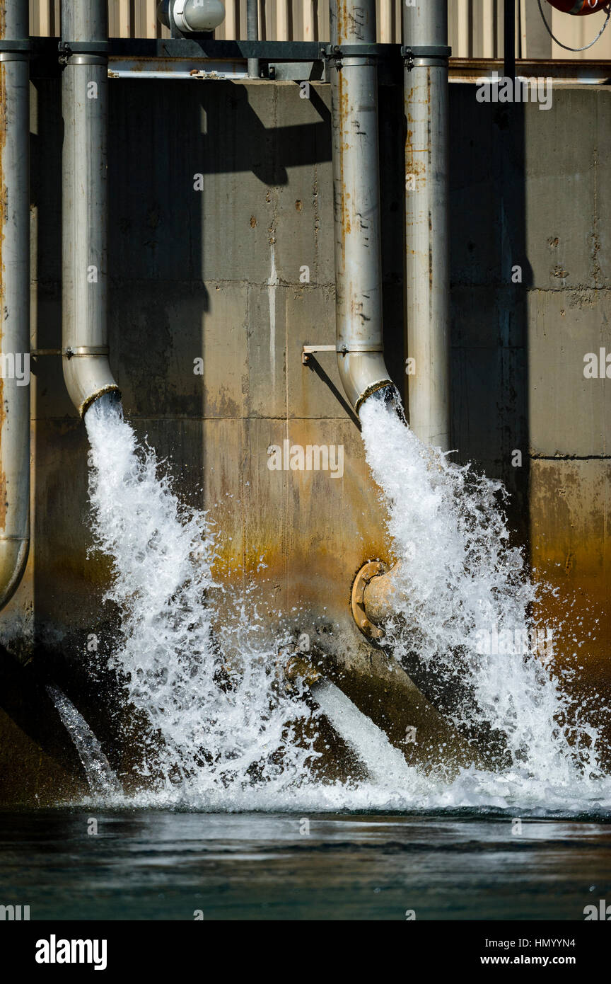 Water pours from the outlet station of the Ord River hydro power plant. Stock Photo