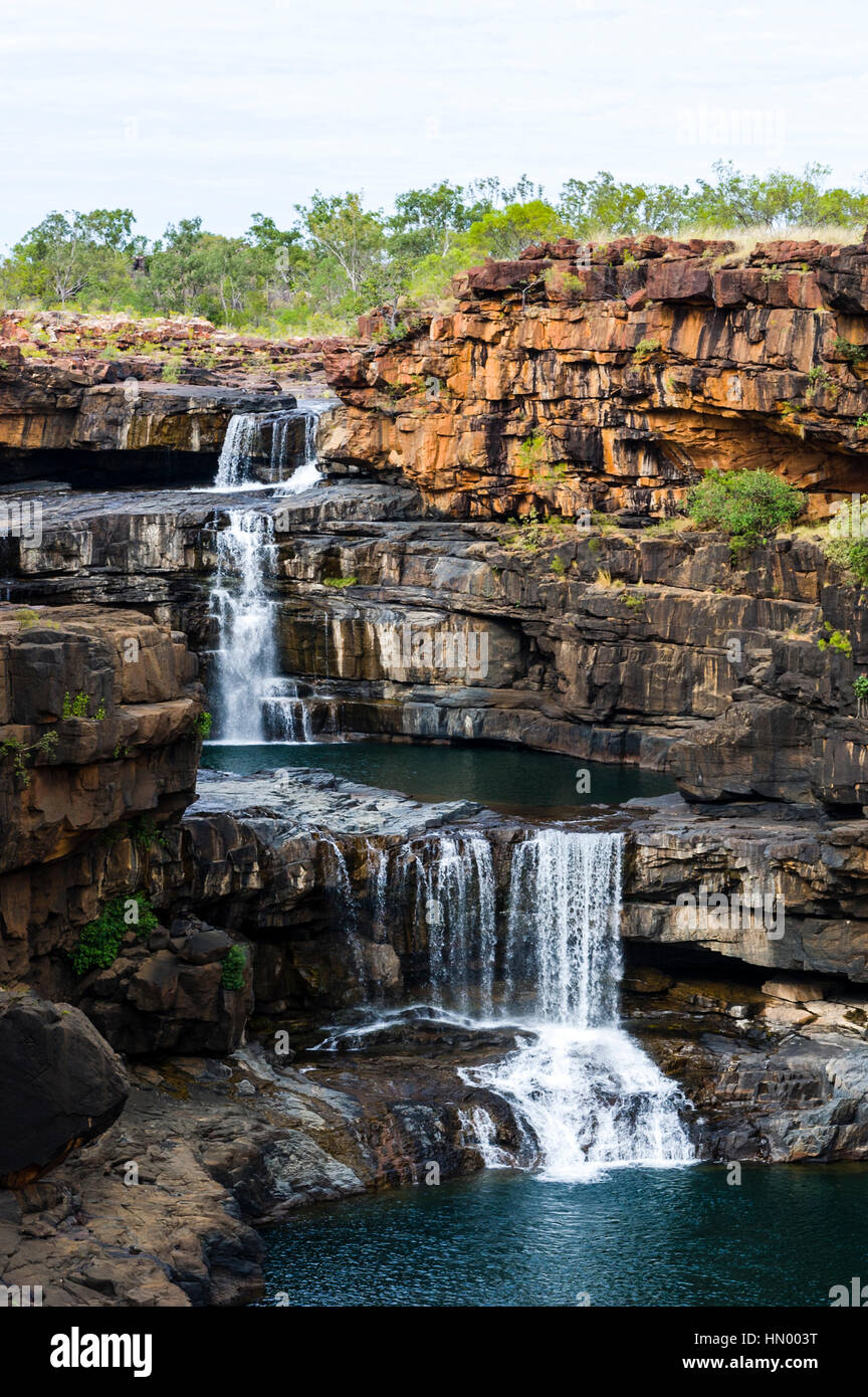 The magnificent Mitchell River cascades down ochre sandstone tiers in multiple waterfalls. Stock Photo