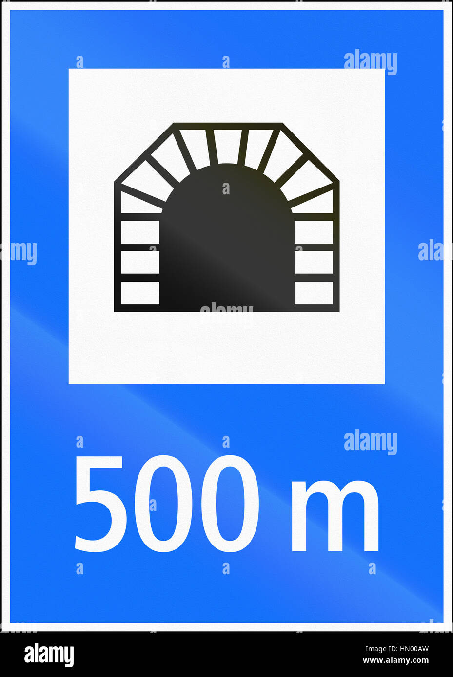 Road sign used in Switzerland - Distance to tunnel Stock Photo - Alamy